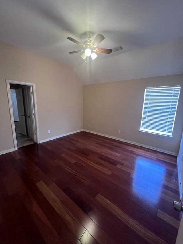 8205 Fountain Springs Dr, Plano, TX 75025 - spare room with wood-type flooring, a ceiling fan, baseboards, and vaulted ceiling