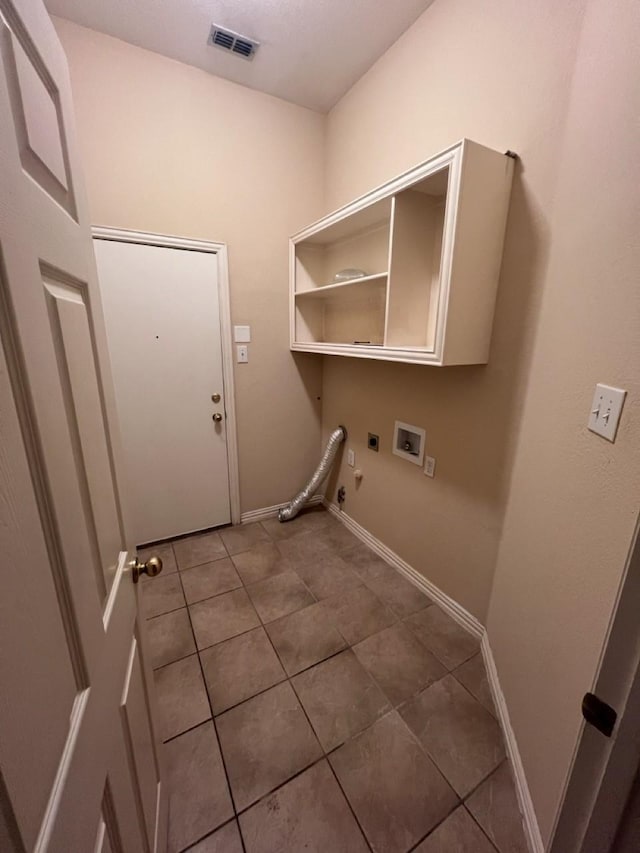 8205 Fountain Springs Dr, Plano, TX 75025 - laundry room featuring gas dryer hookup, hookup for an electric dryer, tile patterned floors, washer hookup, and baseboards
