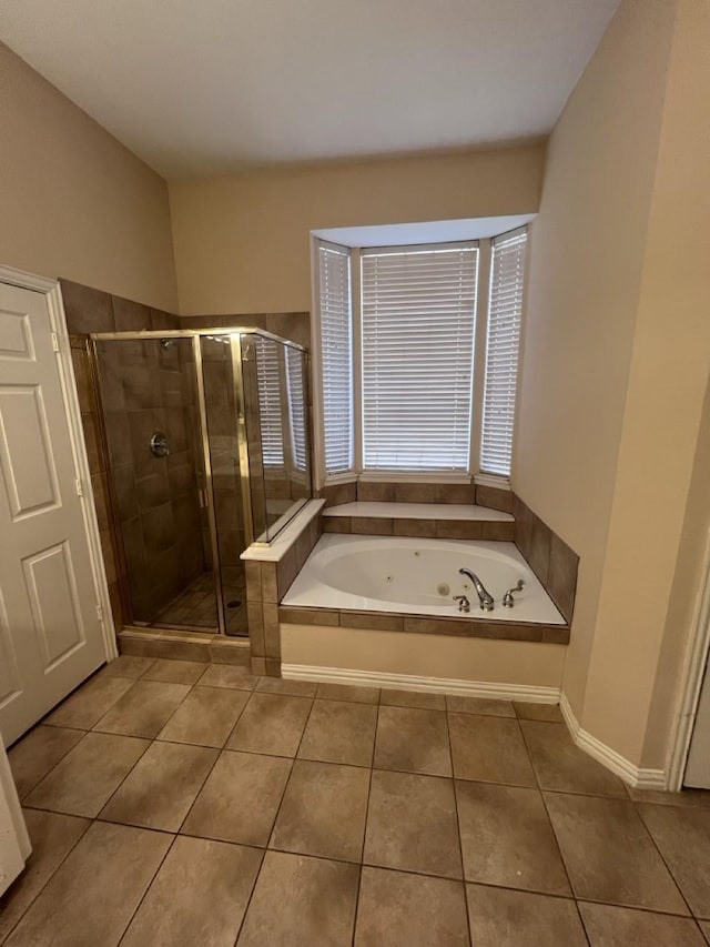 8205 Fountain Springs Dr, Plano, TX 75025 - full bathroom with tile patterned floors, a shower stall, and a whirlpool tub