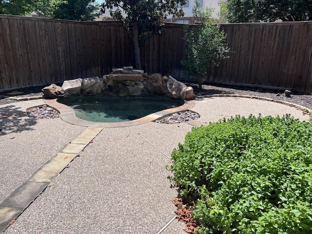 8205 Fountain Springs Dr, Plano, TX 75025 - view of swimming pool featuring a fenced backyard and a pool