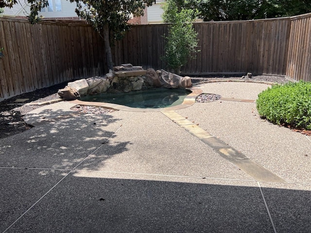 8205 Fountain Springs Dr, Plano, TX 75025 - view of swimming pool with a fenced backyard and a patio area