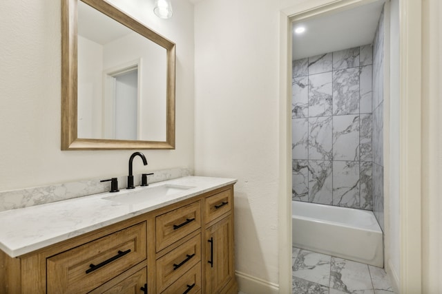 bathroom with marble finish flooring, vanity, and  shower combination