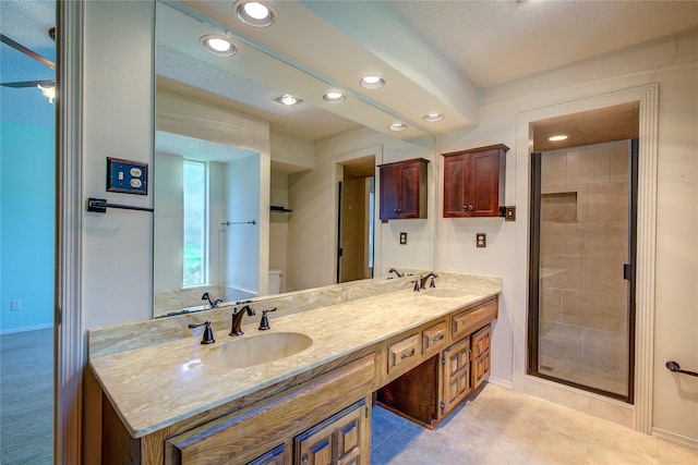 3438 Morning Star Ln, Garland, TX 75043 - bathroom featuring recessed lighting, baseboards, a shower stall, double vanity, and toilet