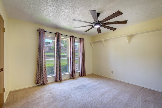 3438 Morning Star Ln, Garland, TX 75043 - carpeted spare room with ceiling fan, a textured ceiling, and baseboards