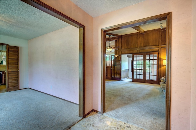 3438 Morning Star Ln, Garland, TX 75043 - hall featuring carpet flooring, a textured ceiling, french doors, and baseboards