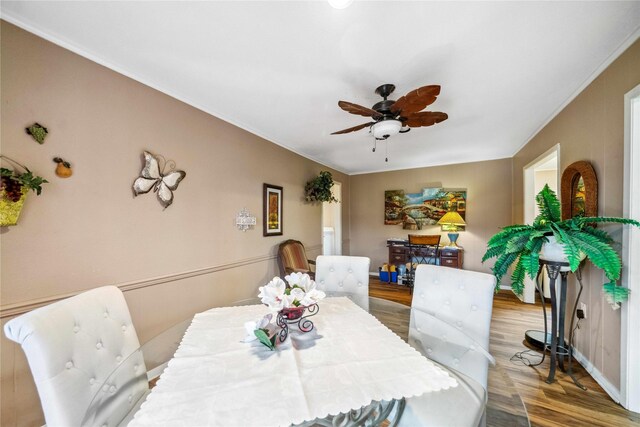 7223 Fm 2494, Athens, TX 75751 - dining area featuring wood finished floors, a ceiling fan, and ornamental molding