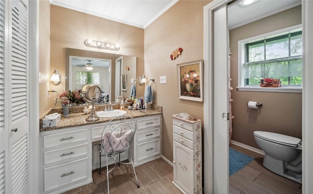 7223 Fm 2494, Athens, TX 75751 - bathroom featuring ornamental molding, wood finished floors, vanity, a closet, and baseboards