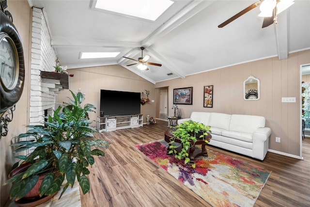 7223 Fm 2494, Athens, TX 75751 - living room featuring a ceiling fan, a skylight, and wood finished floors