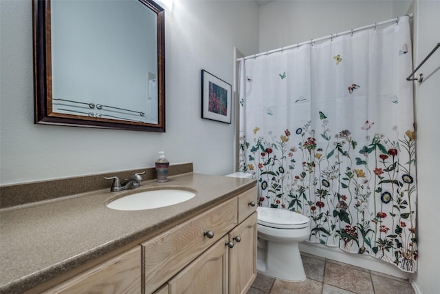 full bathroom with toilet and vanity