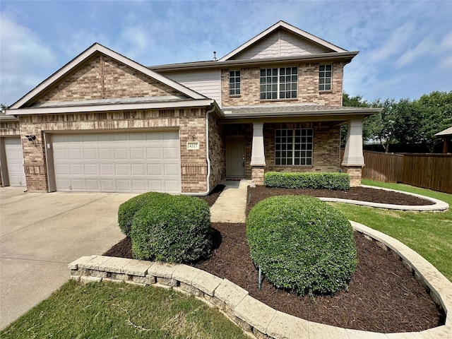 4317 Bay Meadow Dr, Denton, TX 76210 - view of front of property featuring concrete driveway, a garage, and brick siding