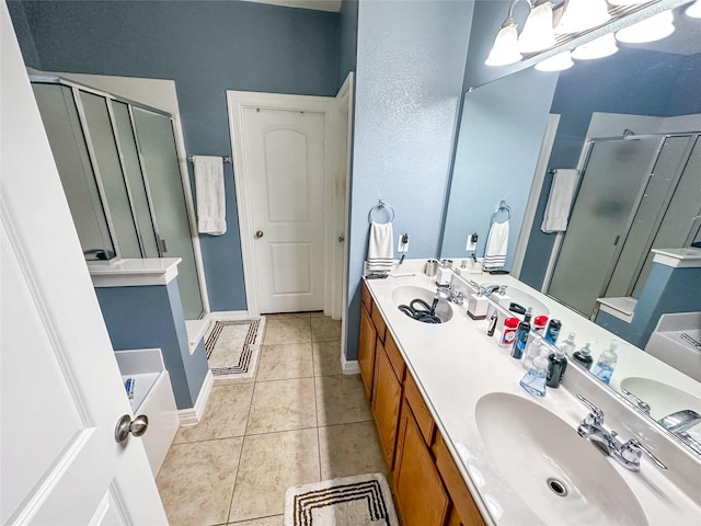 4317 Bay Meadow Dr, Denton, TX 76210 - full bathroom featuring a stall shower, tile patterned floors, a garden tub, and double vanity