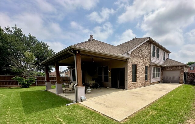 4317 Bay Meadow Dr, Denton, TX 76210 - rear view of property with brick siding, a shingled roof, a patio area, an attached garage, and concrete driveway