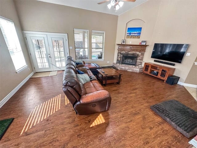 4317 Bay Meadow Dr, Denton, TX 76210 - living area with a ceiling fan, baseboards, a fireplace, wood finished floors, and vaulted ceiling