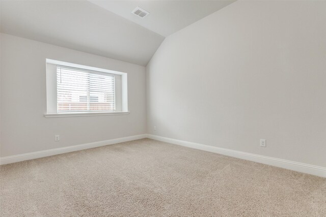 771 Elm Park Dr, Prosper, TX 75078 - carpeted empty room featuring vaulted ceiling and baseboards