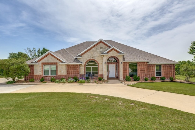 3209 S Bay Breeze Ln, Fort Worth, TX 76179 - view of front of property featuring brick siding, a front lawn, and roof with shingles
