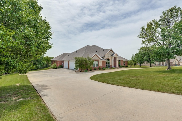 3209 S Bay Breeze Ln, Fort Worth, TX 76179 - view of front of house with an attached garage, concrete driveway, a front yard, and brick siding