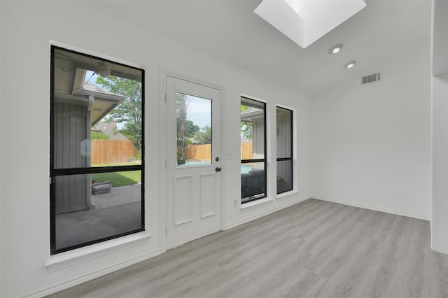 2541 Belmeade Dr, Carrollton, TX 75006 - spare room featuring a skylight, wood finished floors, baseboards, and recessed lighting