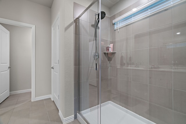 3112 Kingsgarden Rd, Denton, TX 76207 - full bath with a shower stall, tile patterned flooring, and baseboards
