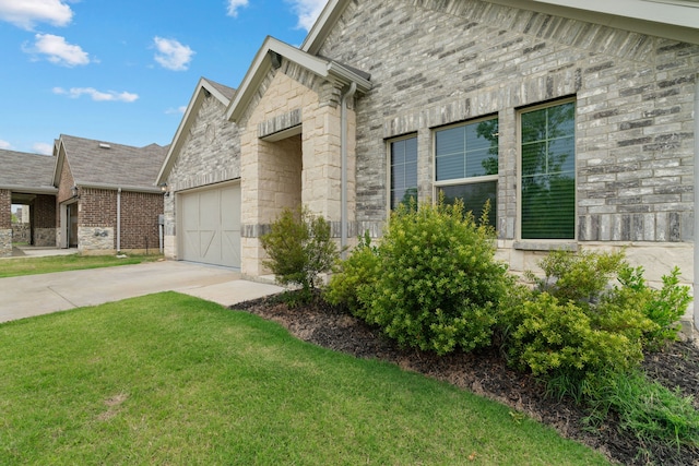 3112 Kingsgarden Rd, Denton, TX 76207 - view of front of home with stone siding, concrete driveway, a front yard, and a garage