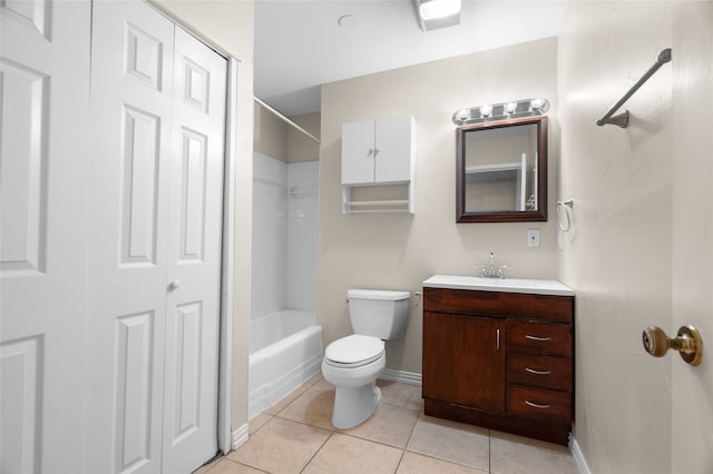 bathroom with toilet, tile patterned floors, baseboards, and vanity