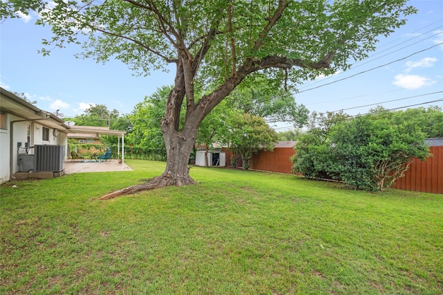 view of yard with a patio and central AC