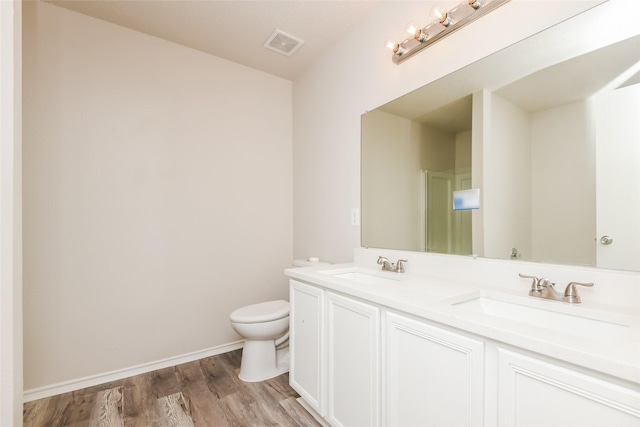 4913 Creek Ridge Trl, Fort Worth, TX 76179 - bathroom with toilet, wood finished floors, double vanity, and baseboards