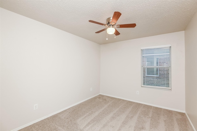 4913 Creek Ridge Trl, Fort Worth, TX 76179 - spare room with light carpet, ceiling fan, baseboards, and a textured ceiling