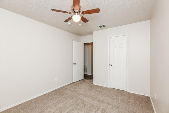 4913 Creek Ridge Trl, Fort Worth, TX 76179 - unfurnished bedroom featuring a textured ceiling, light colored carpet, baseboards, and ceiling fan