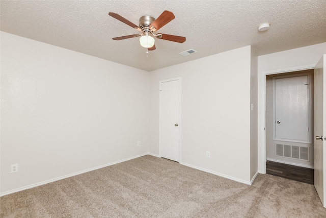 4913 Creek Ridge Trl, Fort Worth, TX 76179 - unfurnished bedroom with light carpet, baseboards, a textured ceiling, and ceiling fan