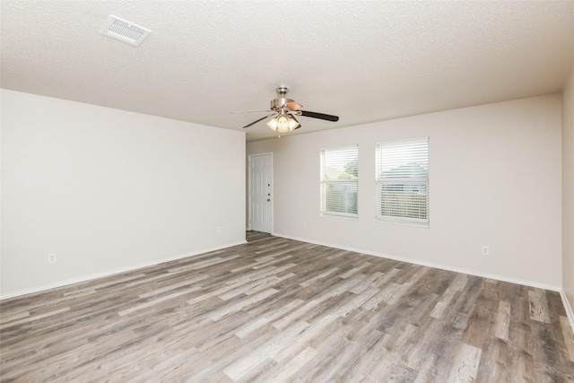4913 Creek Ridge Trl, Fort Worth, TX 76179 - unfurnished room with wood finished floors, a ceiling fan, baseboards, and a textured ceiling
