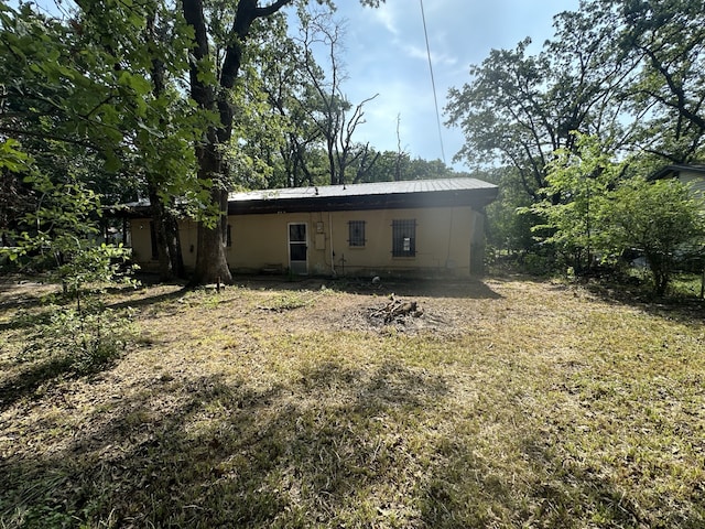 1505 Grove Dr, West Tawakoni, TX 75474 - back of house with metal roof