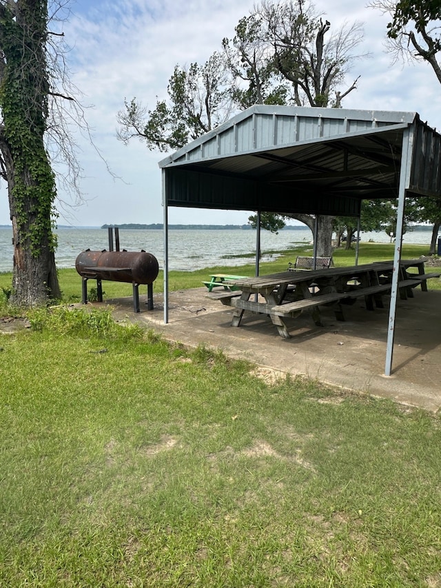 1505 Grove Dr, West Tawakoni, TX 75474 - view of home's community with a water view and a lawn