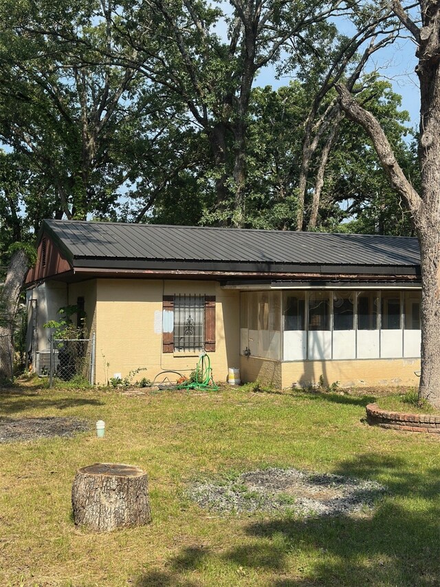 1505 Grove Dr, West Tawakoni, TX 75474 - single story home with concrete block siding and metal roof