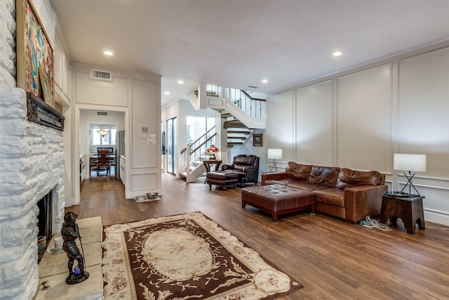 3552 Granada Ave Unit B, University Park, TX 75205 - living area with a decorative wall, wood finished floors, stairway, a fireplace, and recessed lighting