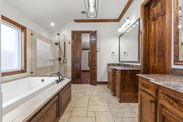 2100 Tremont Ave, Fort Worth, TX 76107 - bathroom with a stall shower, vanity, a garden tub, vaulted ceiling, and baseboards
