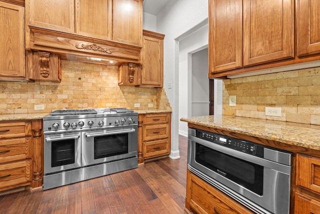 2100 Tremont Ave, Fort Worth, TX 76107 - kitchen featuring double oven range, backsplash, wall oven, and dark wood-type flooring