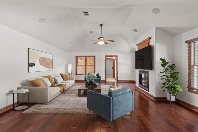 2100 Tremont Ave, Fort Worth, TX 76107 - living room with a glass covered fireplace, baseboards, hardwood / wood-style flooring, a ceiling fan, and vaulted ceiling