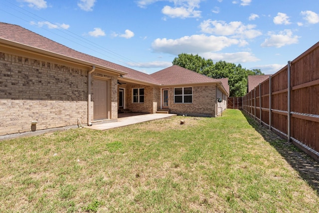 2100 Tremont Ave, Fort Worth, TX 76107 - rear view of house featuring a patio, brick siding, and a shingled roof