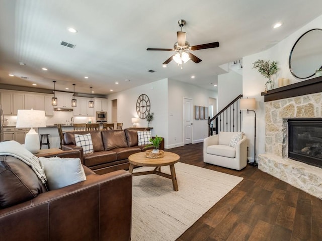 916 Timber Ridge Dr, Justin, TX 76247 - living area featuring dark wood-type flooring, ceiling fan, a fireplace, baseboards, and recessed lighting