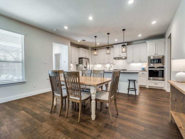 916 Timber Ridge Dr, Justin, TX 76247 - dining space featuring recessed lighting, dark wood finished floors, and baseboards