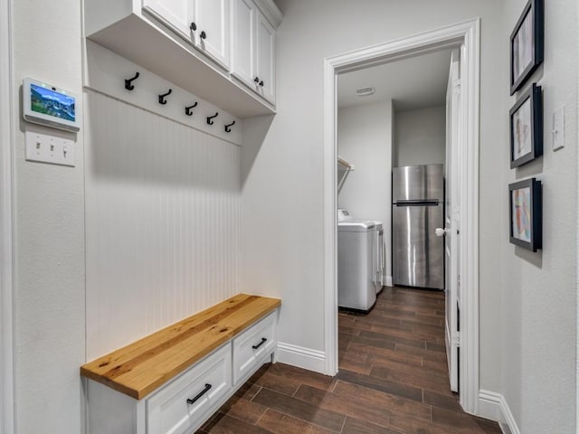 916 Timber Ridge Dr, Justin, TX 76247 - mudroom featuring wood tiled floors, baseboards, and separate washer and dryer