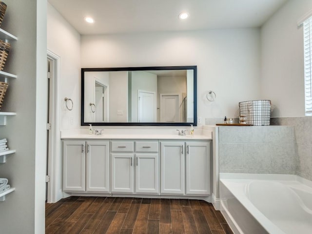 916 Timber Ridge Dr, Justin, TX 76247 - full bath with a bath, wood finished floors, double vanity, and recessed lighting