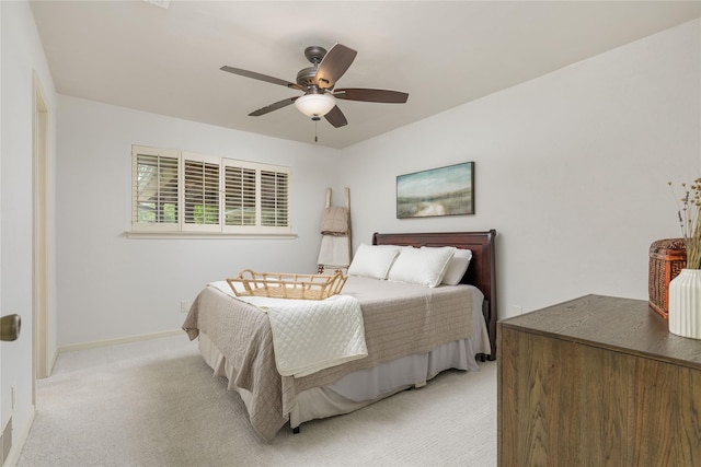 3212 Woodwind Ln, Dallas, TX 75229 - bedroom featuring light carpet, a ceiling fan, and baseboards