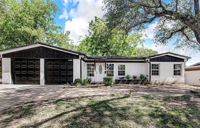 6225 Kentwood Pl, Fort Worth, TX 76112 - ranch-style home with a garage, brick siding, and driveway