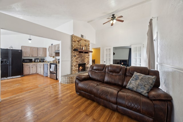 3812 Longmeadow Way, Fort Worth, TX 76133 - living area with high vaulted ceiling, light wood-style floors, a fireplace, and ceiling fan