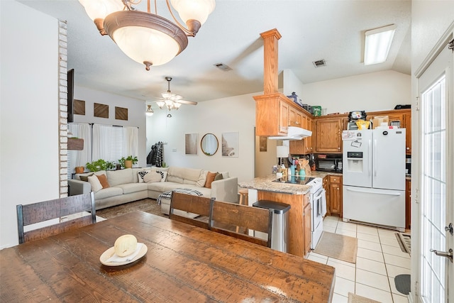 1112 Bayfield Dr, Denton, TX 76209 - dining space featuring light tile patterned floors, a ceiling fan, and lofted ceiling