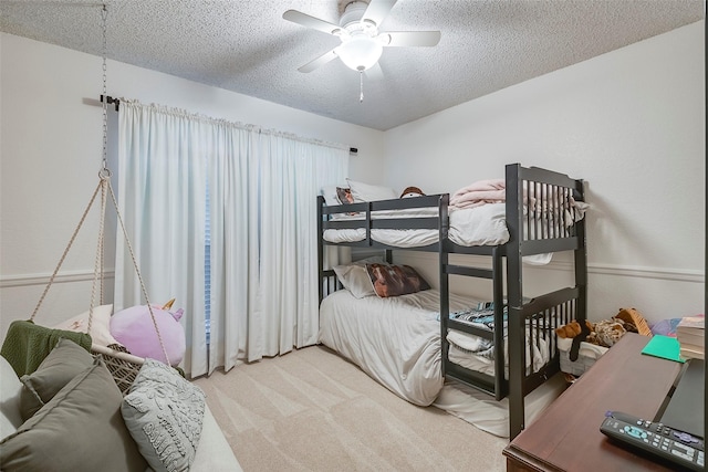 1112 Bayfield Dr, Denton, TX 76209 - carpeted bedroom with a textured ceiling and a ceiling fan