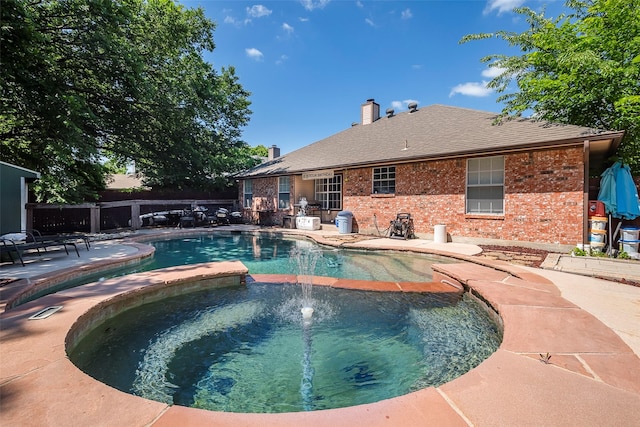 1112 Bayfield Dr, Denton, TX 76209 - view of swimming pool with a patio area, a pool with connected hot tub, and fence