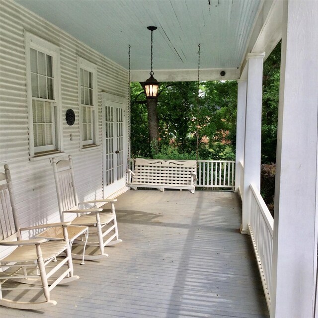 1014 N Sycamore St, Palestine, TX 75801 - wooden deck featuring a porch and french doors
