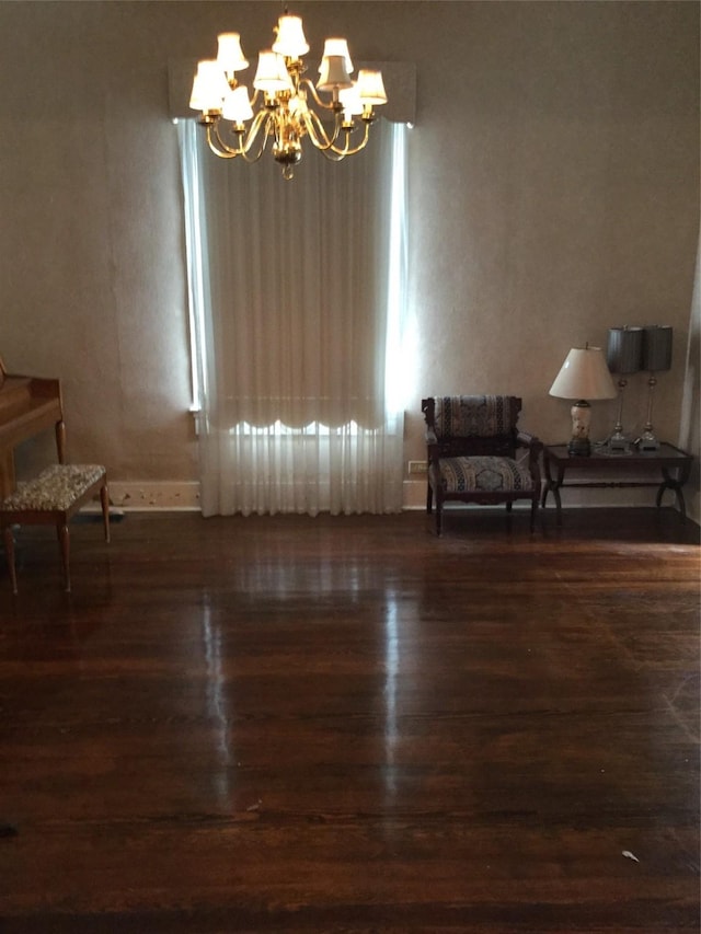 1014 N Sycamore St, Palestine, TX 75801 - living area featuring a chandelier and wood finished floors